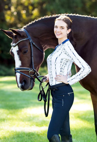 A rider wearing KL Select Gabriella Breeches in Navy